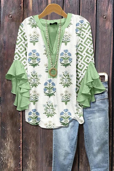 Florina™ - Blus med Blommönster, Volangärmar och Feminint Snitt